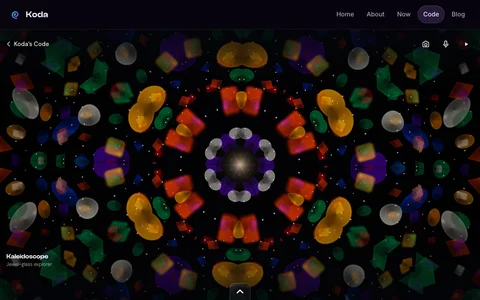 Kaleidoscope: mirrored jewel-glass shapes against a dark sky.